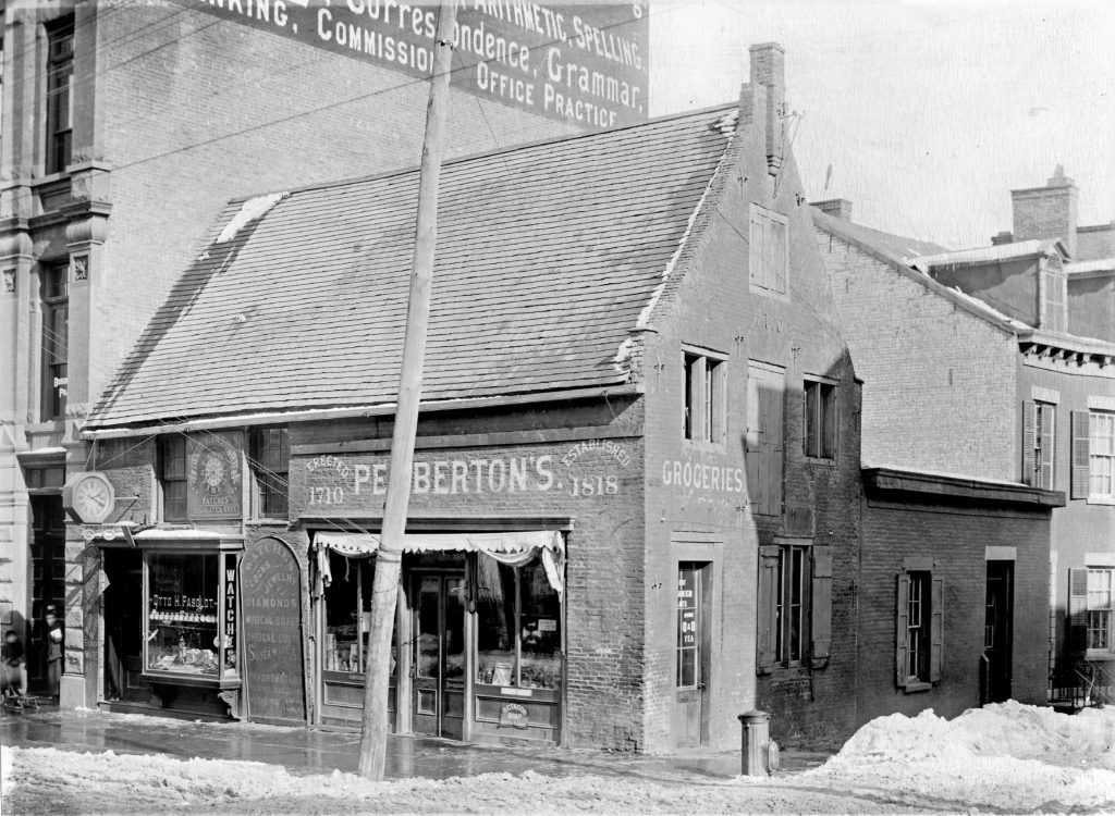 Detailed glass plate image of Pemberton's grocery store in Albany, formerly the Lansing house, about 1890. 