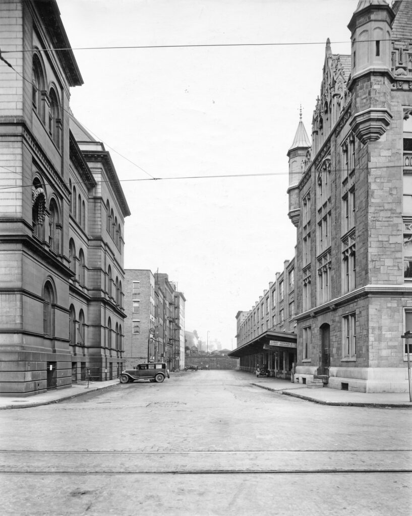 Photograph of Dean Street in Albany, NY, circa 1931, showing the old Federal Building and Post office on the left, and part of the Delaware and Hudson Railroad headquarters on the right.