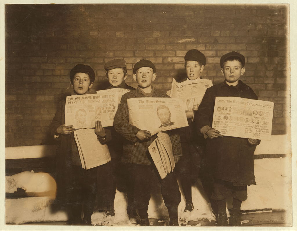 This photo by celebrated photographer Lewis Wickes Hine, posted by the Library of Congress, shows a group of newsboys who were selling evening papers in saloons and stores. It was taken "in an alley in back of the City Jail at 10 P.M"  in February , 1910. Many of the Hine photographs lack identification of the subjects, but for this one, we are gifted with  full identification. The newsboys are identified as, left to right: Dominick Mardilo, 28 1/2 Fulton Street; Roderick Towle, 44 Sheridan Ave.; William Towle, brother, 44 Sheridan Ave.; Louis Strasburg, 40 Mulberry Street; Max Erlich, 101 Dallius Street.